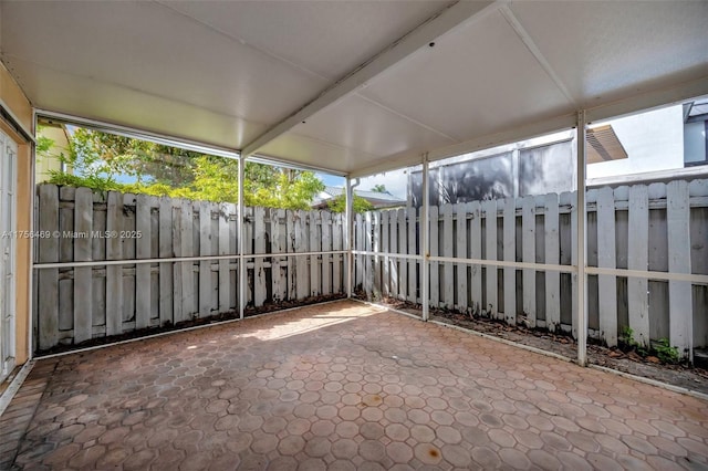 unfurnished sunroom featuring a wealth of natural light