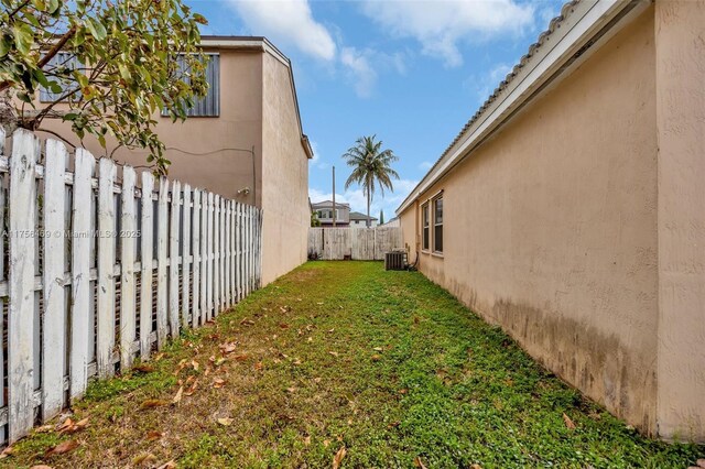 9820 SW 154th Pl, Miami, FL 33196 - view of yard featuring a fenced backyard and central AC