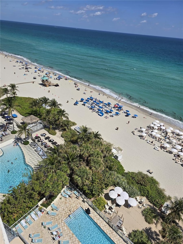 bird's eye view with a beach view and a water view