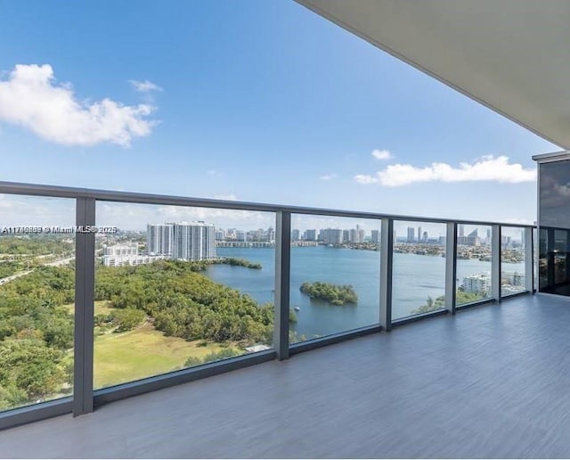 balcony with a view of city and a water view