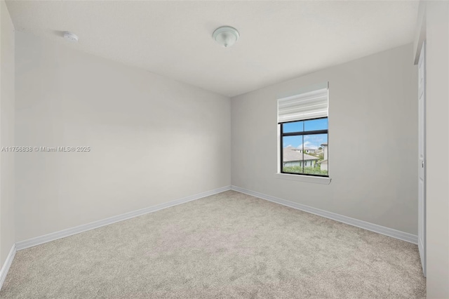 3142 Poinciana St, Lauderdale Lakes, FL 33311 - carpeted empty room with baseboards