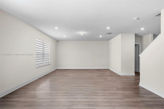 3142 Poinciana St, Lauderdale Lakes, FL 33311 - empty room featuring wood finished floors, baseboards, visible vents, and recessed lighting