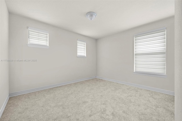 3142 Poinciana St, Lauderdale Lakes, FL 33311 - empty room featuring baseboards and carpet flooring