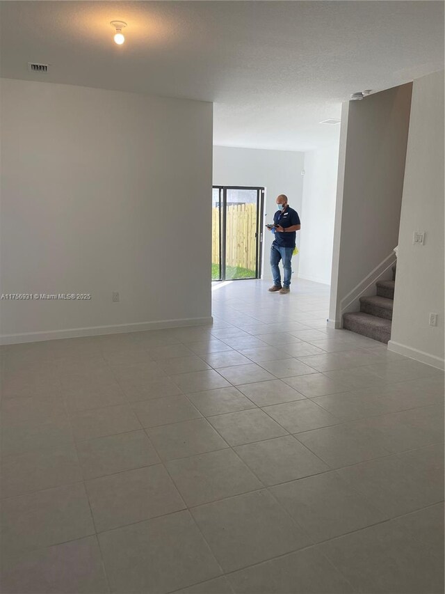 13384 SW 287th St, Homestead, FL 33033 - empty room with light tile patterned floors, baseboards, stairs, and visible vents