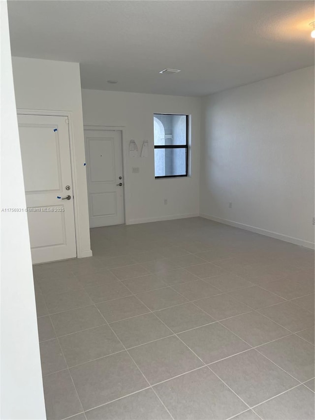 13384 SW 287th St, Homestead, FL 33033 - unfurnished room featuring light tile patterned floors and baseboards