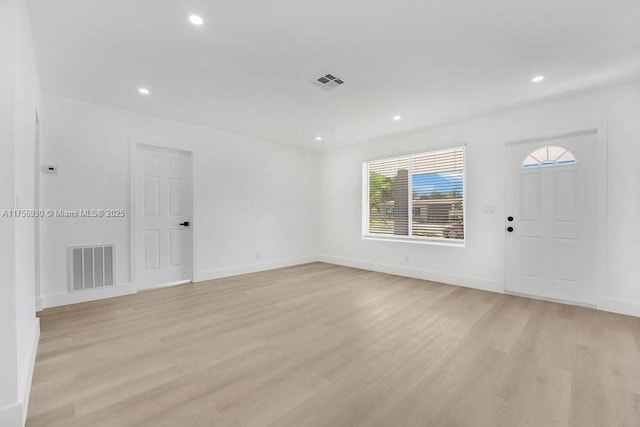 unfurnished room featuring recessed lighting, visible vents, and light wood-style flooring