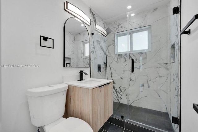 full bath featuring toilet, a marble finish shower, vanity, and recessed lighting