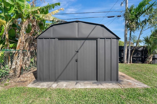 view of shed with a fenced backyard