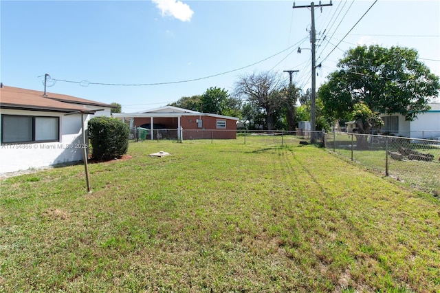 view of yard with a fenced backyard