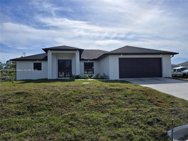 prairie-style home featuring driveway, an attached garage, a front lawn, and stucco siding