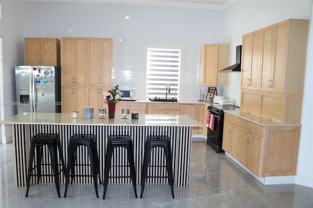 kitchen with white microwave, wall chimney range hood, a center island, black electric range oven, and stainless steel fridge