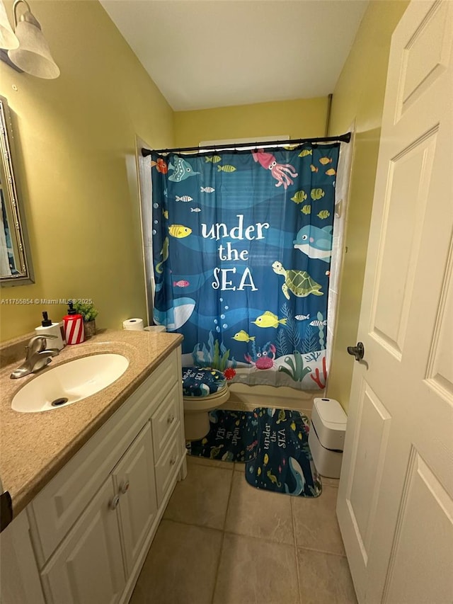 full bathroom with shower / tub combo with curtain, vanity, toilet, and tile patterned floors