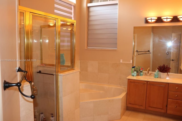 bathroom with vanity, tile patterned flooring, a shower stall, and a bath