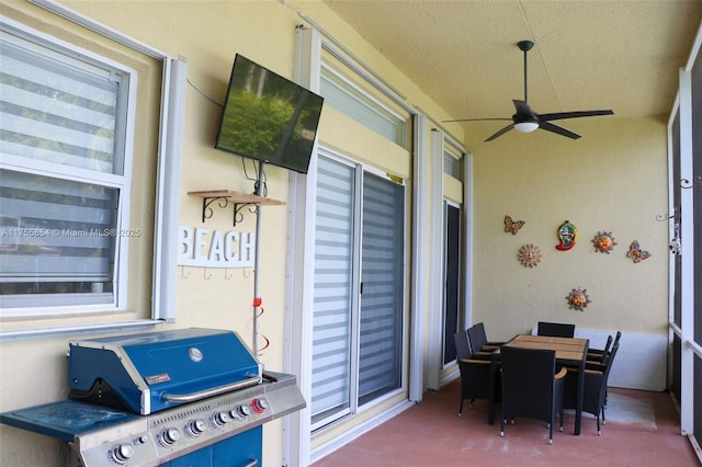 exterior space featuring outdoor dining space, grilling area, and a ceiling fan