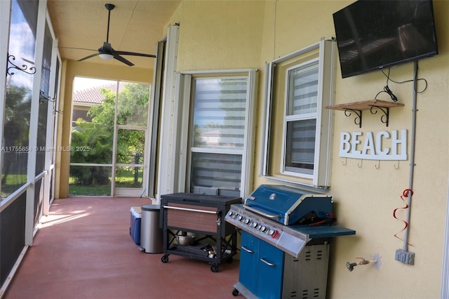 sunroom featuring ceiling fan