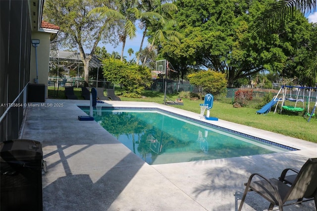 view of swimming pool with a fenced in pool, a playground, a yard, grilling area, and a patio area