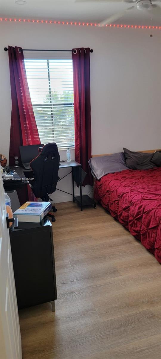 bedroom with light wood-style flooring