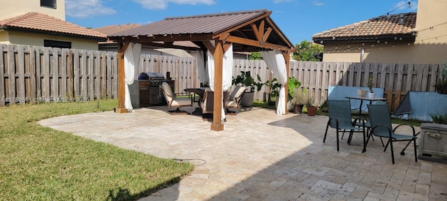 view of patio / terrace featuring a fenced backyard and a gazebo