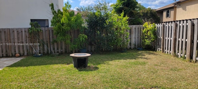 view of yard with a fenced backyard