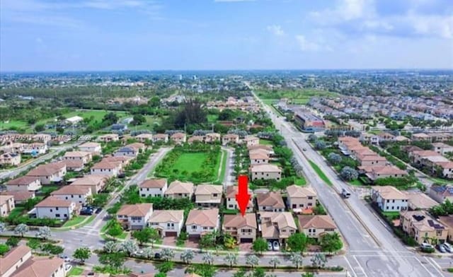 birds eye view of property with a residential view