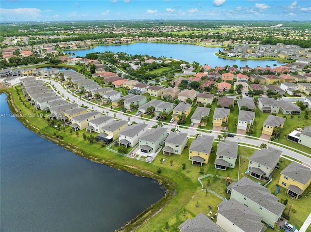 birds eye view of property featuring a residential view and a water view