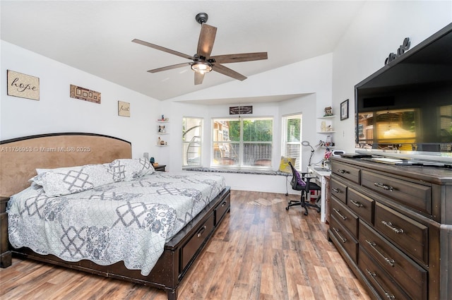 bedroom featuring ceiling fan, vaulted ceiling, and wood finished floors