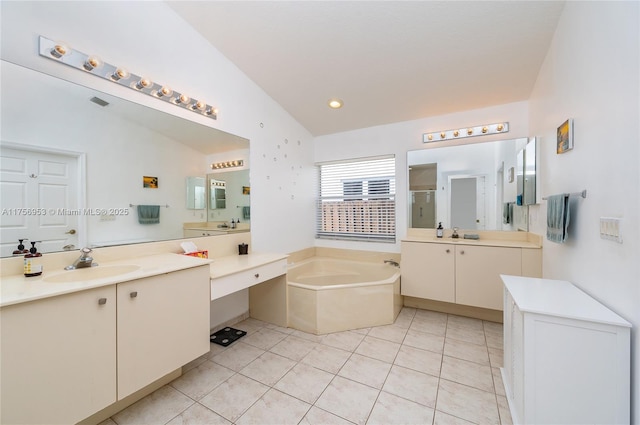 bathroom featuring a sink, tile patterned flooring, two vanities, a shower stall, and a bath