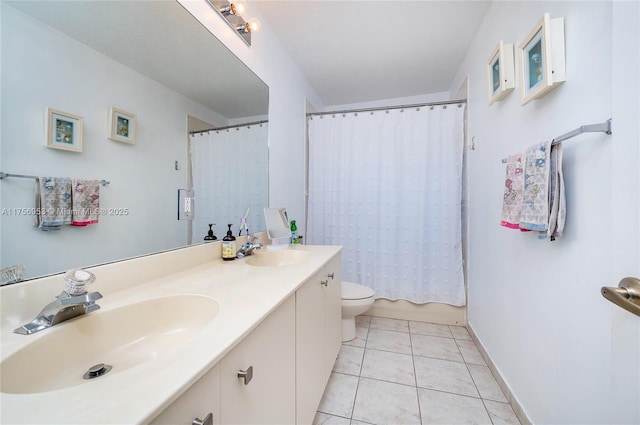 full bathroom with tile patterned flooring, a sink, toilet, and double vanity