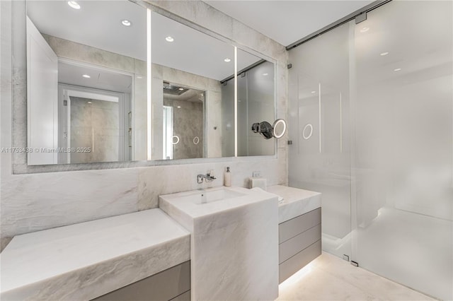 bathroom featuring recessed lighting and vanity