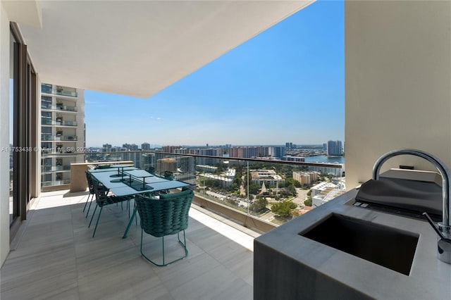 balcony with a view of city and a sink