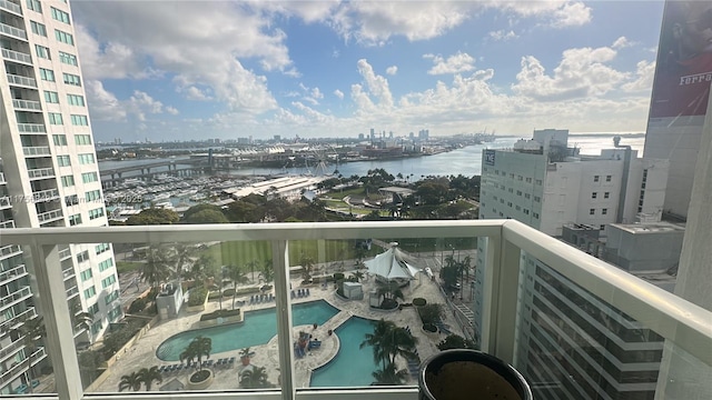 balcony featuring a water view and a view of city