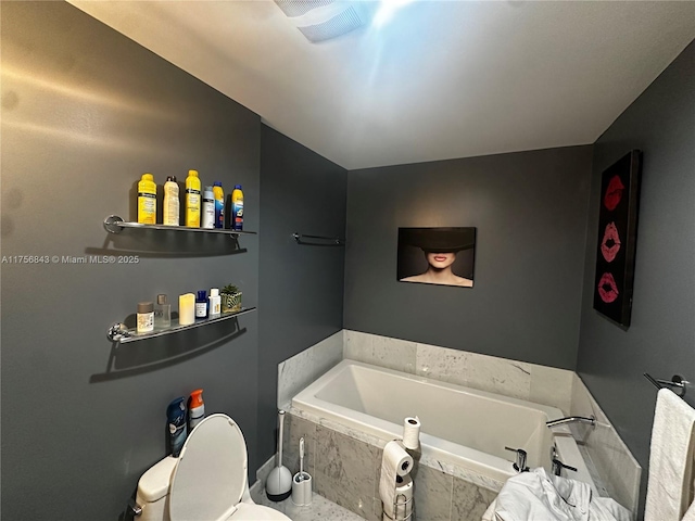 bathroom with a bath and toilet