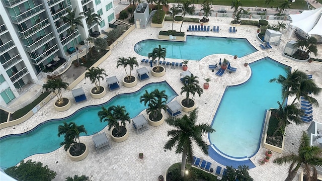 community pool with a patio area