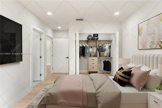 bedroom with radiator heating unit and a closet