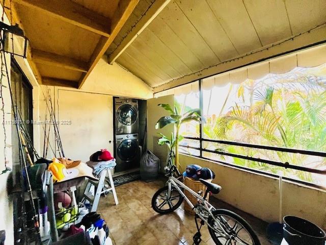 20220 NE 3rd Ct Unit 4, Miami, FL 33179 - sunroom featuring stacked washer / drying machine