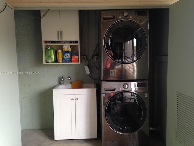 20220 NE 3rd Ct Unit 4, Miami, FL 33179 - laundry area featuring stacked washer / drying machine and cabinet space