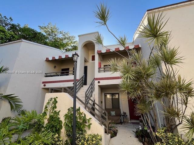20220 NE 3rd Ct Unit 4, Miami, FL 33179 - view of building exterior featuring stairway