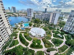 birds eye view of property featuring a water view and a view of city