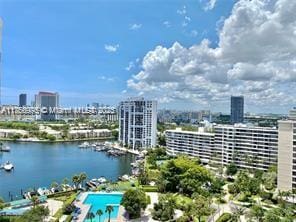 exterior space featuring a water view and a view of city