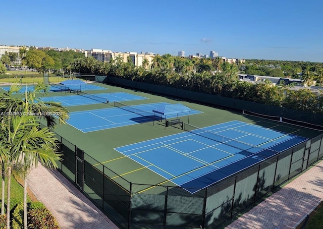 view of tennis court featuring fence