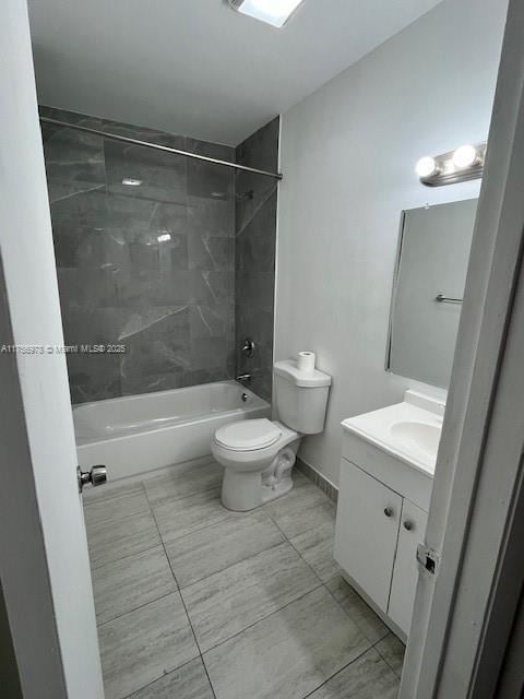 full bathroom with toilet, shower / bath combination, baseboards, and vanity