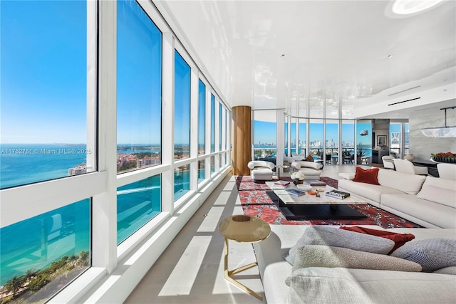 100 S Pointe Dr Unit 2803, Miami Beach, FL 33139 - living area with a water view, floor to ceiling windows, and healthy amount of natural light