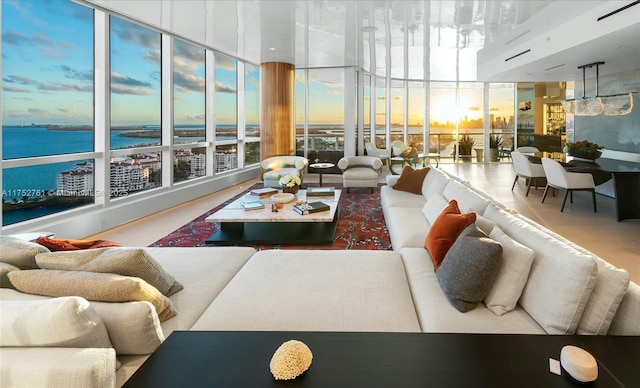 100 S Pointe Dr Unit 2803, Miami Beach, FL 33139 - living area featuring a water view and a wall of windows