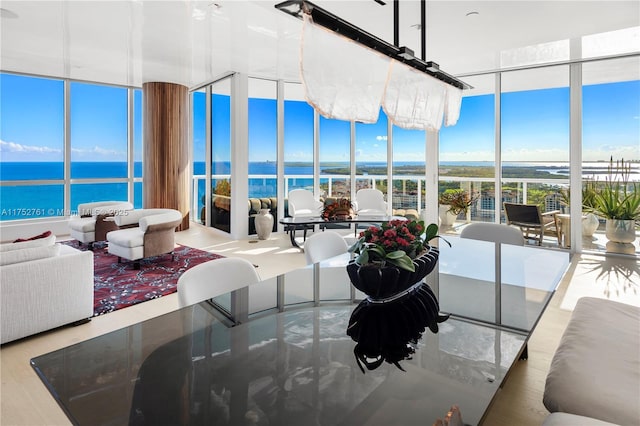 sunroom / solarium with a water view