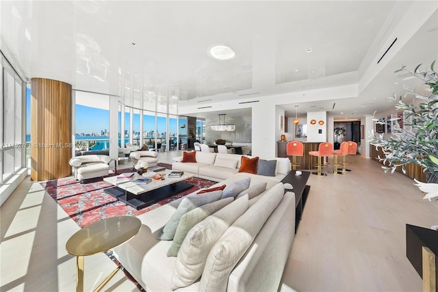 living room featuring a view of city and wood finished floors