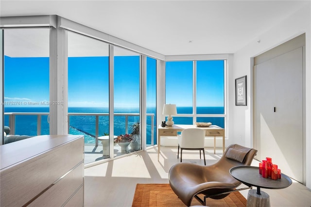 sunroom with a water view