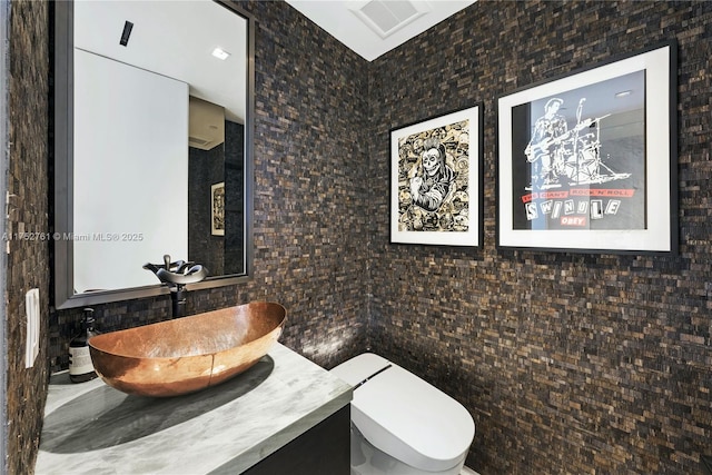 100 S Pointe Dr Unit 2803, Miami Beach, FL 33139 - bathroom with tile walls, vanity, and toilet