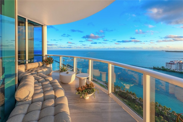 balcony featuring a water view