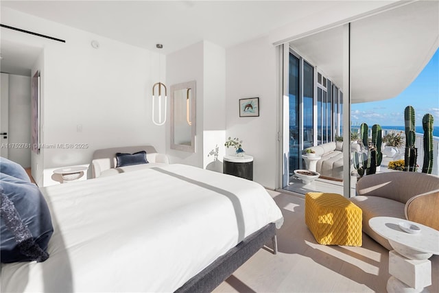 100 S Pointe Dr Unit 2803, Miami Beach, FL 33139 - bedroom with access to exterior and wood finished floors