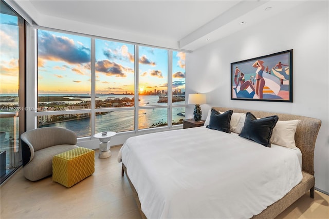 100 S Pointe Dr Unit 2803, Miami Beach, FL 33139 - bedroom featuring a water view, multiple windows, and a wall of windows
